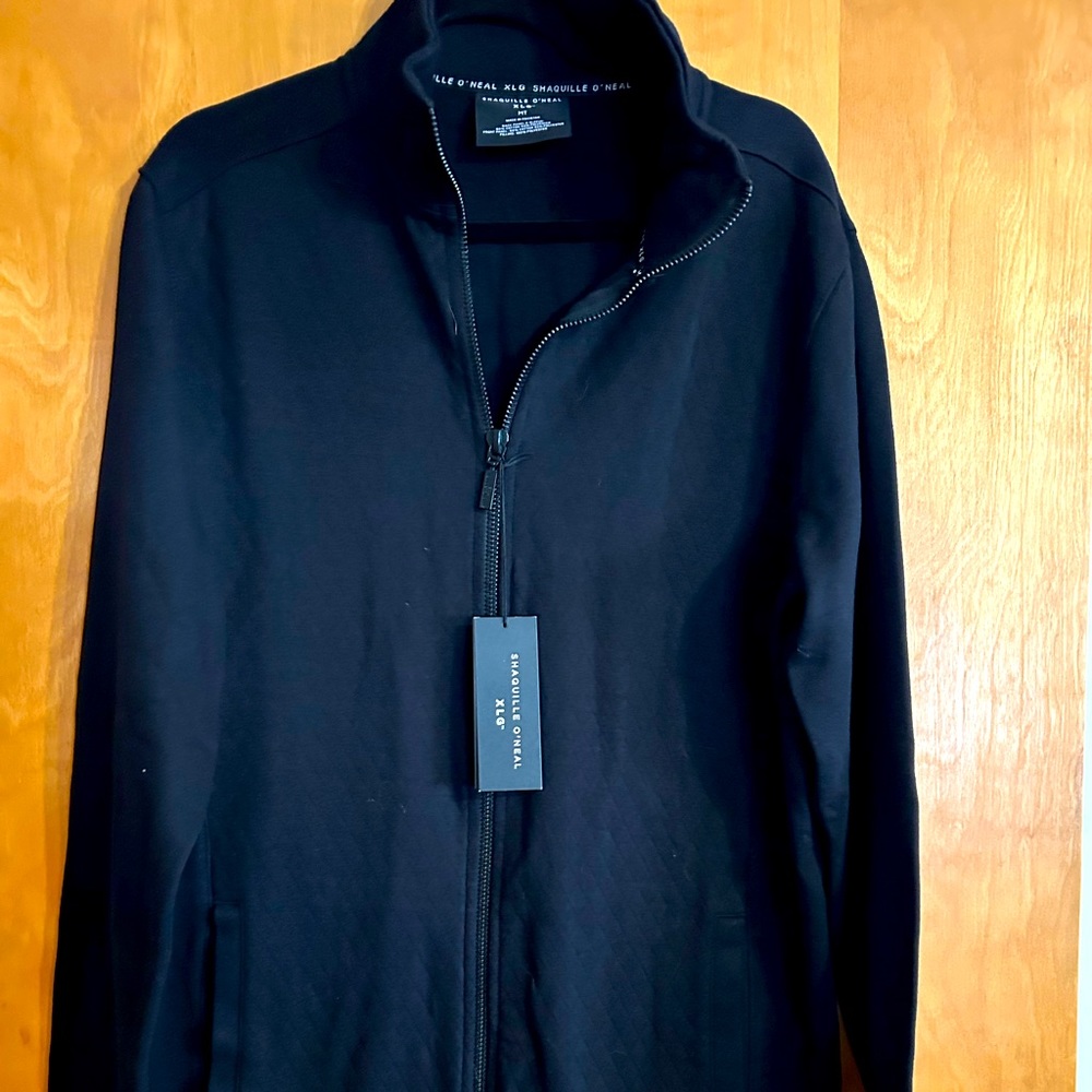 Shaquille O’Neil zip up jacket.